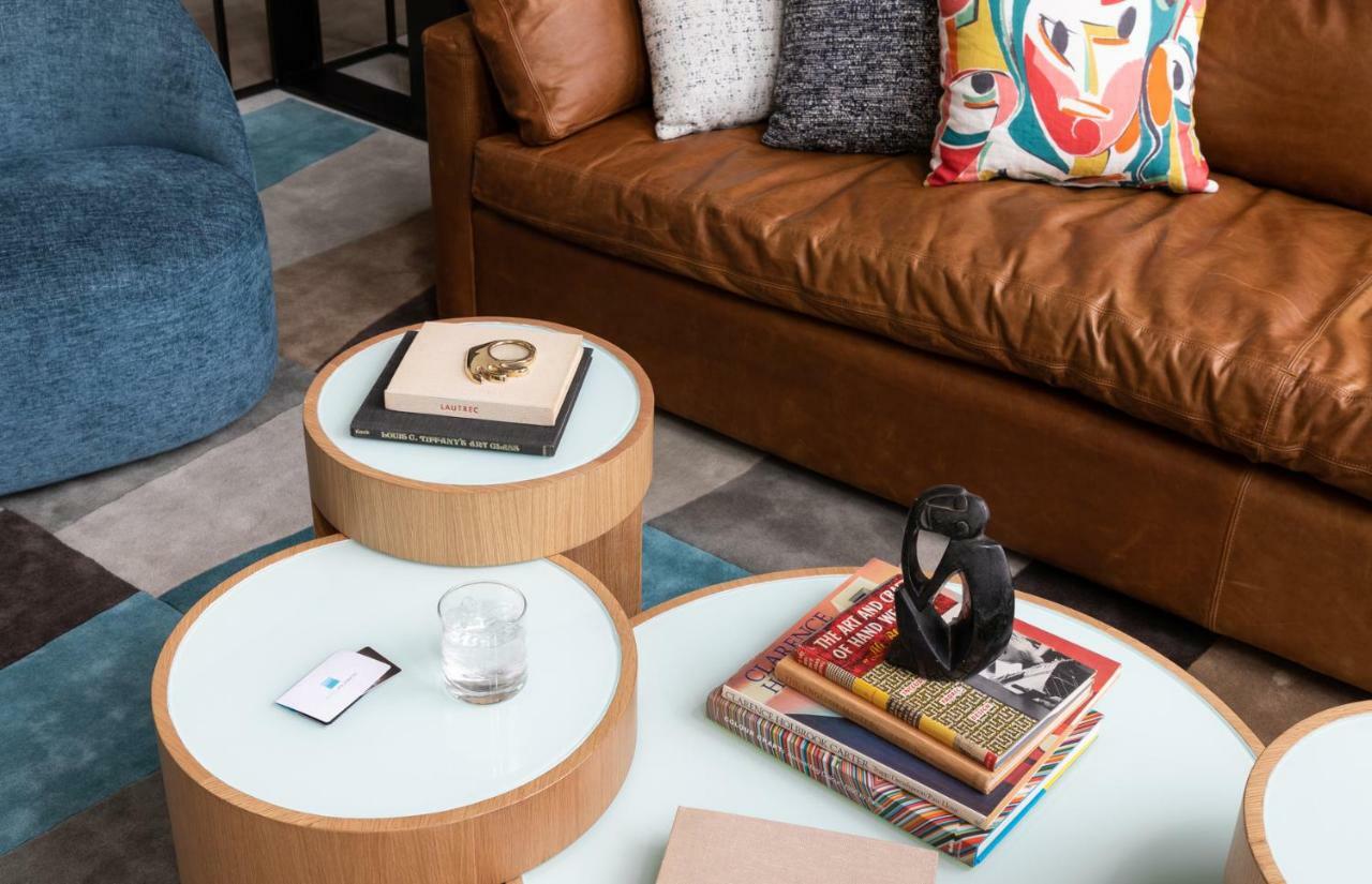 Hotel Murano Tacoma Exteriör bild A coffee table with a stack of books